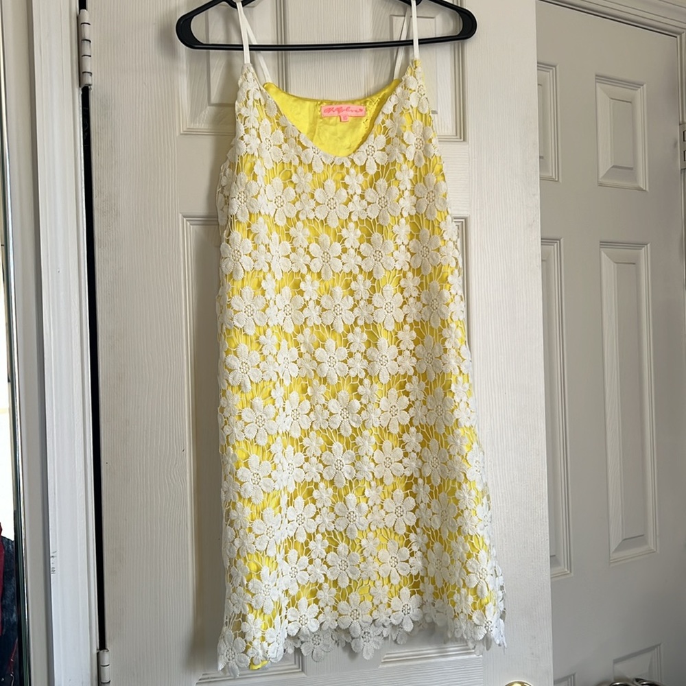 white crochet dress with yellow satin lining.